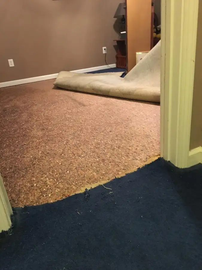 Carpet pad removal revealing water damage during Drying & Dehumidification in La Grande